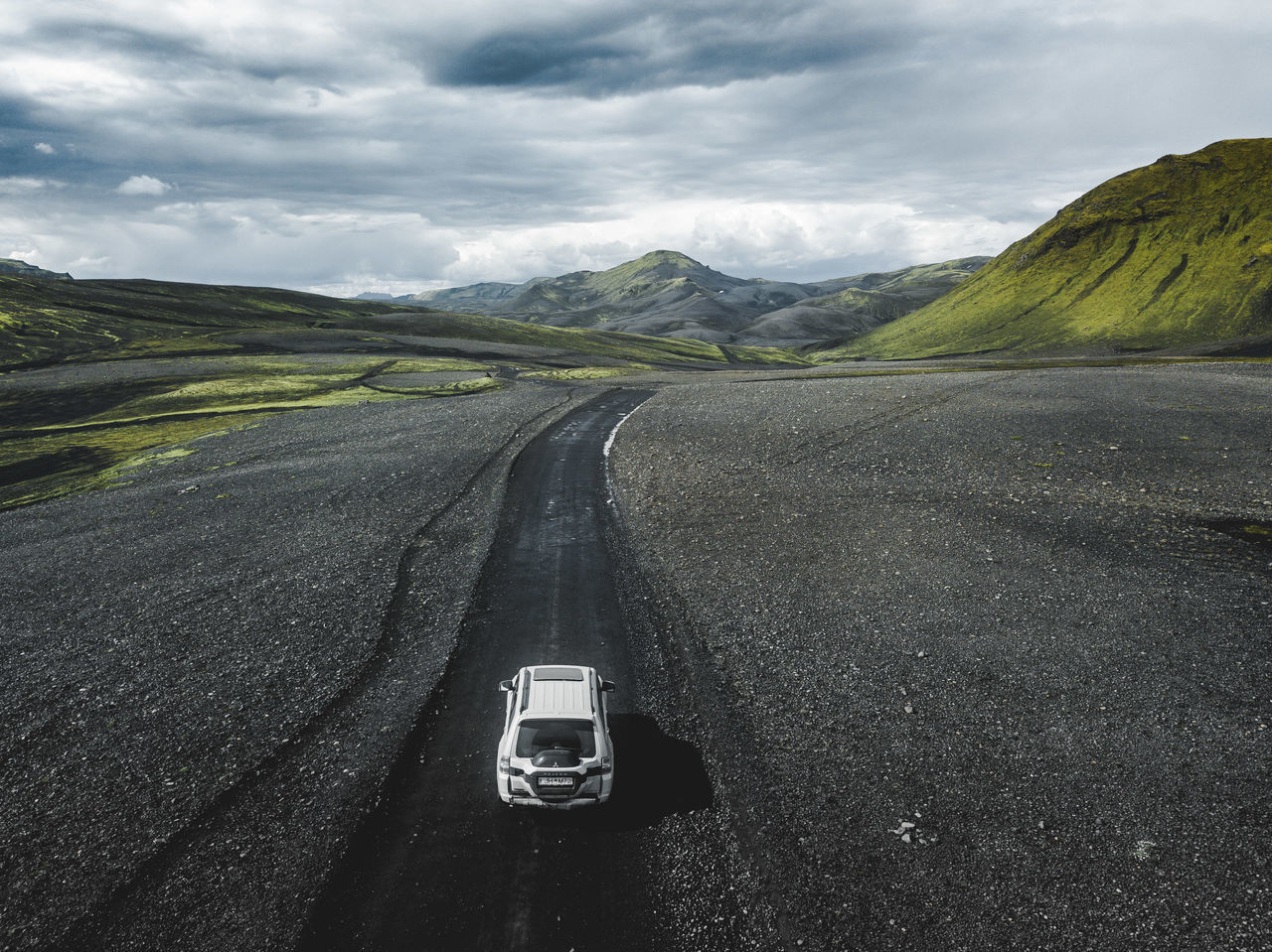 transportation, road, mode of transportation, cloud - sky, car, motor vehicle, sky, the way forward, land vehicle, direction, scenics - nature, landscape, mountain, environment, day, non-urban scene, nature, travel, beauty in nature, no people, outdoors, road trip