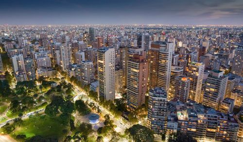 High angle view of modern buildings in city against sky