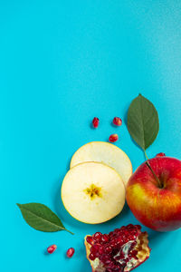 High angle view of apples on blue background