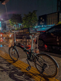 Bicycles on street in city at night