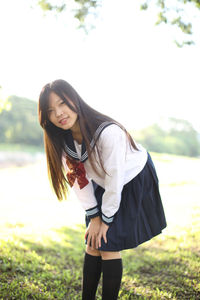 Portrait of smiling woman standing outdoors