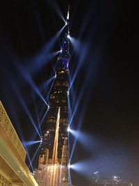 Low angle view of illuminated buildings at night