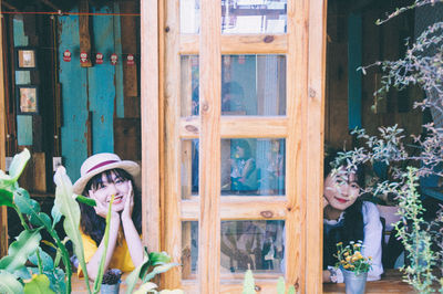 Portrait of woman seen through glass window
