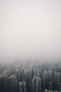 High angle view of buildings in city against clear sky