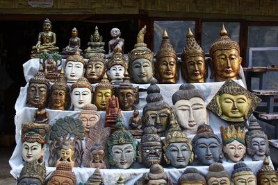 Statue of buddha against historic building