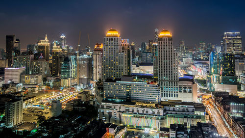 High angle view of illuminated buildings in city at night