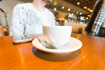 Coffee cup on table in restaurant
