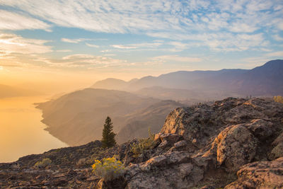 Scenic view of mountains against sky during sunset