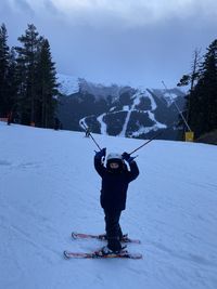 Child skier, mountains, snow
