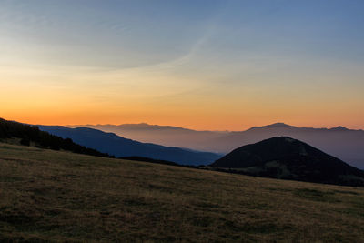 Sunrise from a valley watching the mountains with a little fog. nature concept