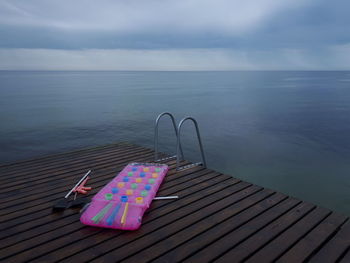 High angle view of pier over sea against sky