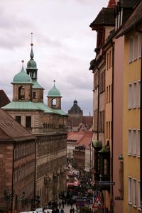 Buildings in city against sky