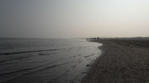 Scenic view of beach against clear sky