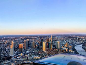 High angle view of buildings against sky during sunset