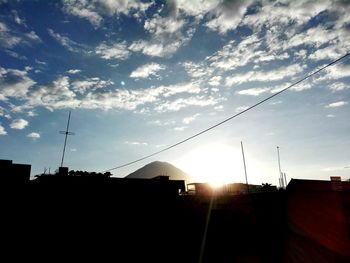 Low angle view of built structure at sunset