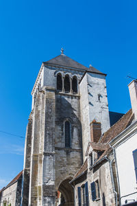 Low angle view of church against clear blue sky