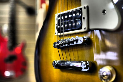 Close-up of guitar on table