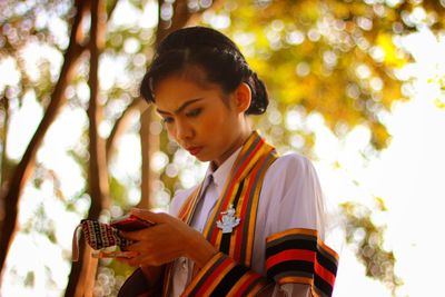 Young woman using mobile phone