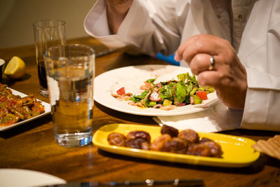 Close-up of man eating food