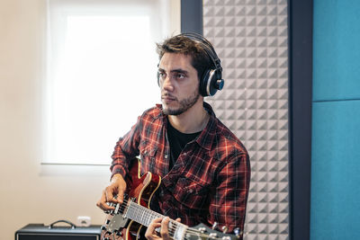 Young man playing guitar