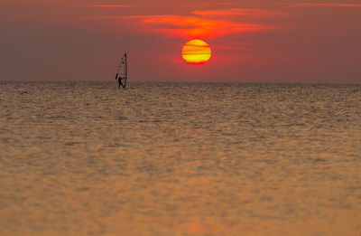 Scenic view of sunset over calm sea