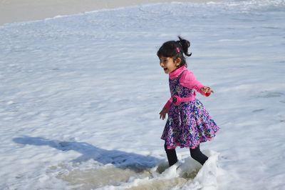 Happy girl on shore at beach