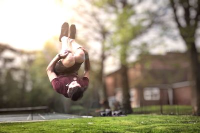 Upside down image of man in park