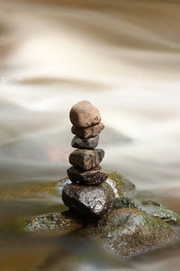 Close-up of stack of pebbles on beach