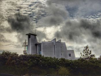 Built structure against cloudy sky