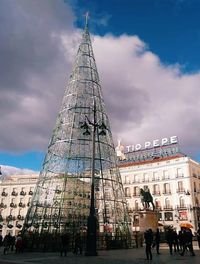 View of buildings against cloudy sky