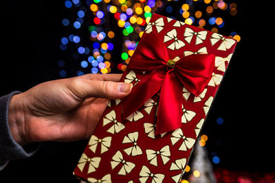 Close-up of hand holding christmas decoration