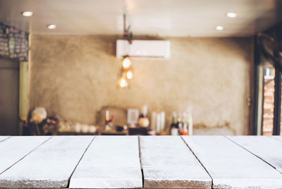 Illuminated electric lamp on table in restaurant