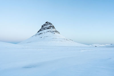 Scenic view of snowcapped mountain against clear blue sky