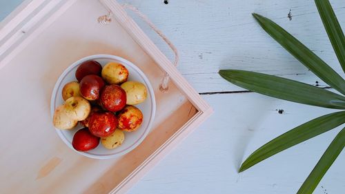 High angle view of fruits in bowl on table