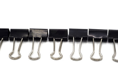 Close-up of empty chairs against white background