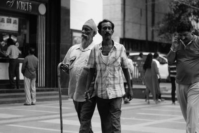 People walking on street in city