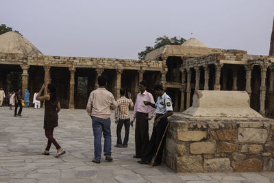 Group of people in front of historical building