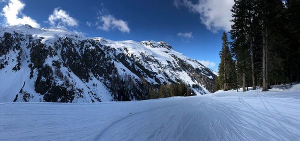 Scenic view of snow covered mountains against sky