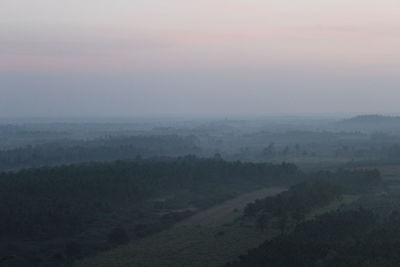 Scenic view of landscape against sky during sunset