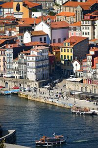 High angle view of townscape by sea