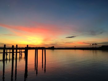 Scenic view of lake against sky during sunset