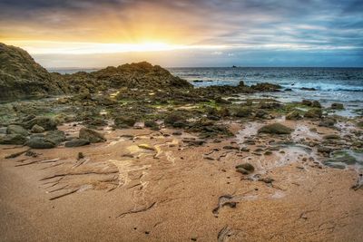 Scenic view of sea against sky during sunset