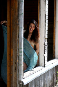 Portrait of smiling young woman dancing