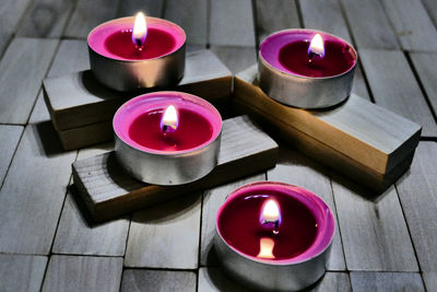 High angle view of tea light candles on table