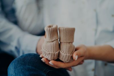 Midsection of woman holding hands