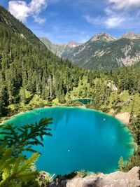 Scenic view of lake and mountains against sky