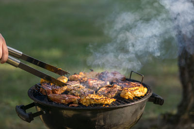 Close-up of meat on barbecue grill