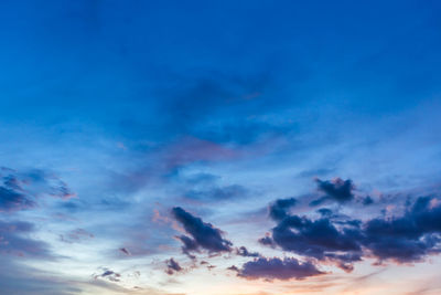 Low angle view of cloudy sky at sunset