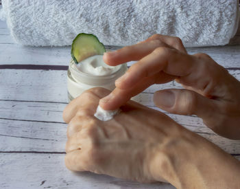 Close-up of hand holding ice cream