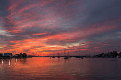 Scenic view of sea against orange sky